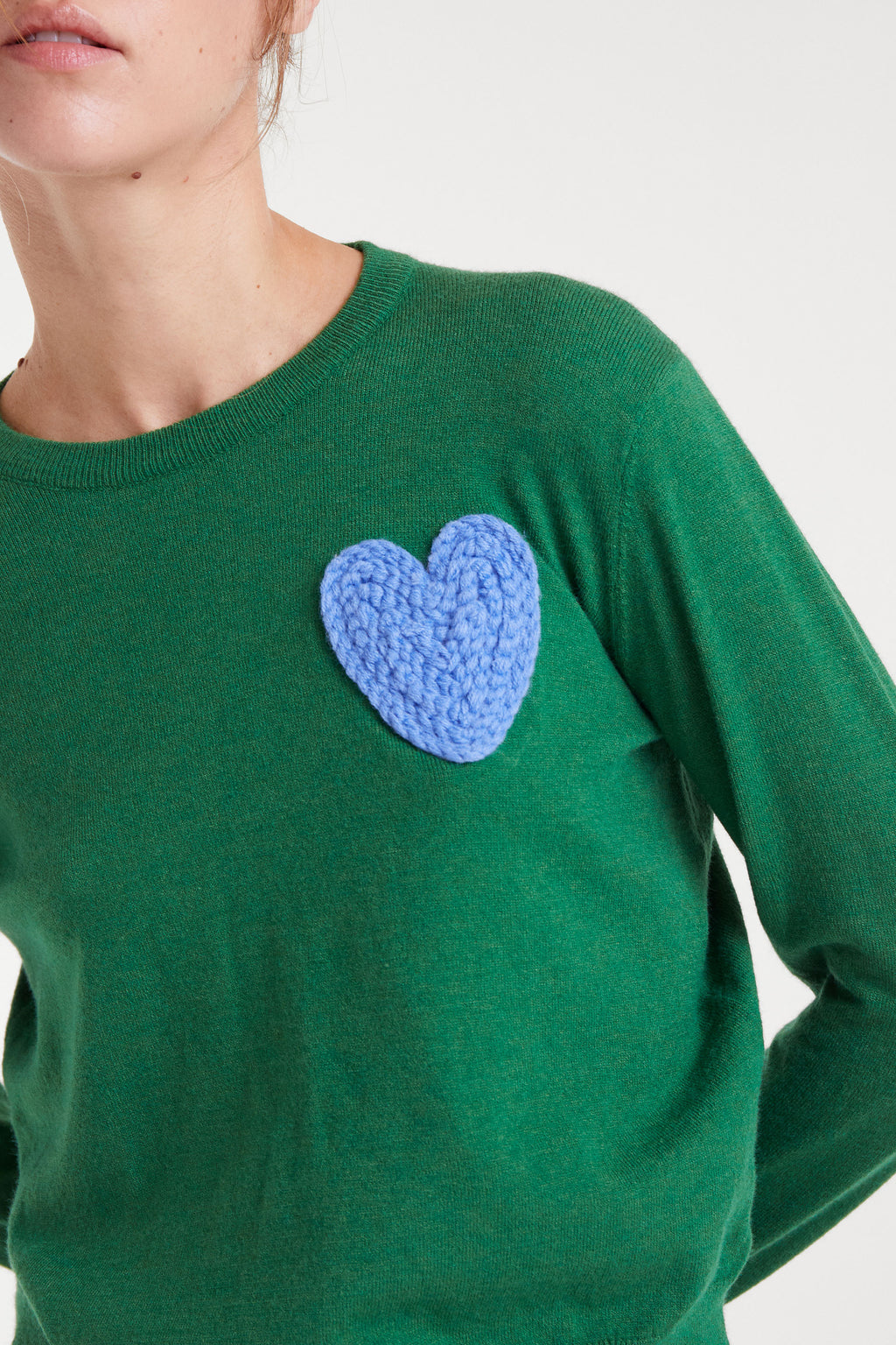 Green Jumper with Blue Heart.