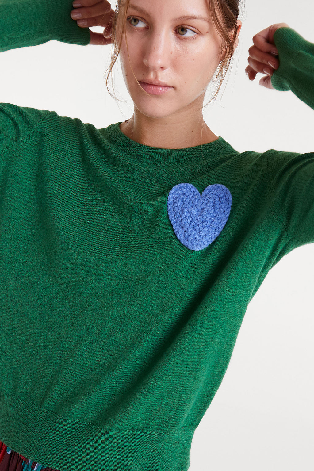 Green Jumper with Blue Heart.