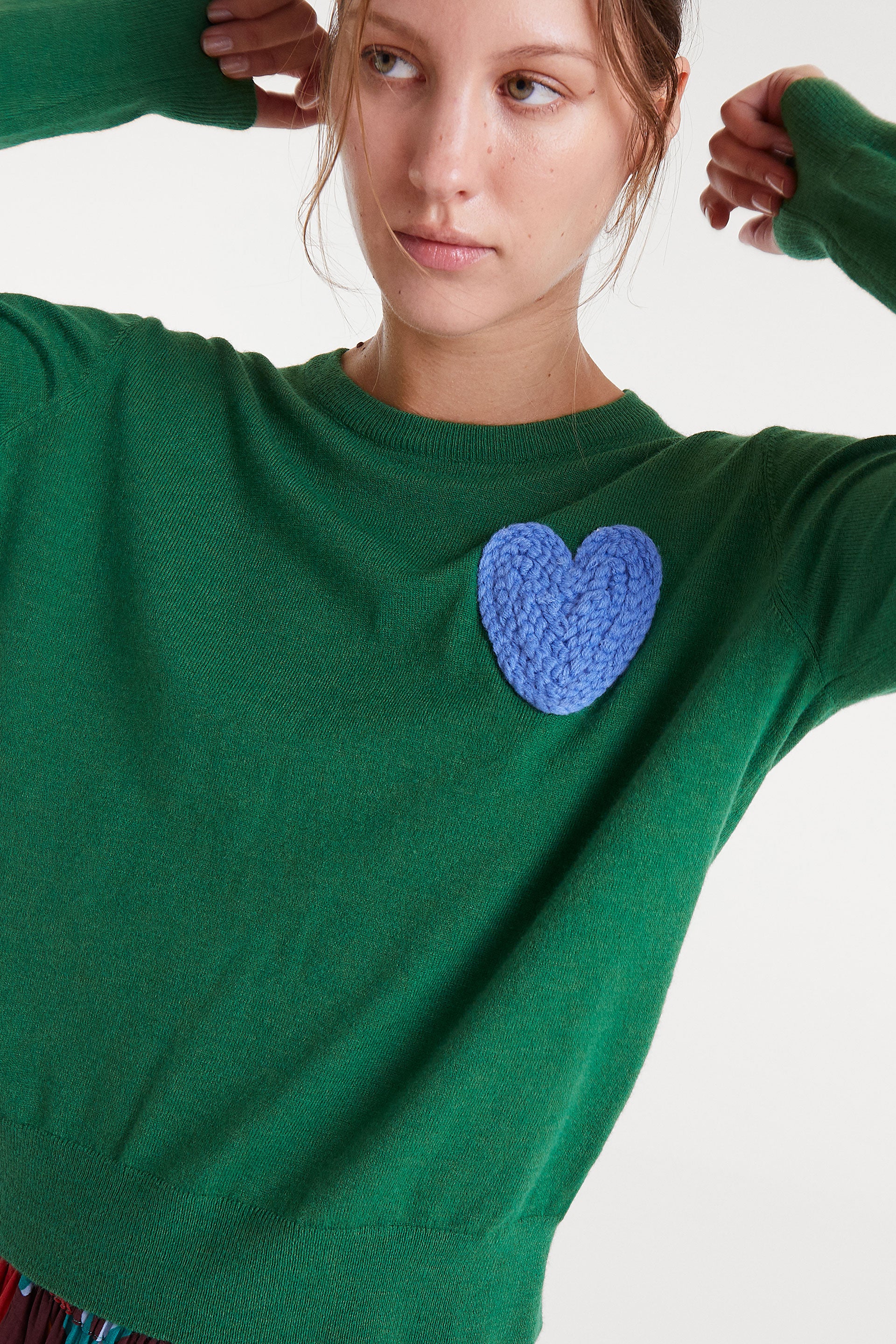 Green Jumper with Blue Heart.