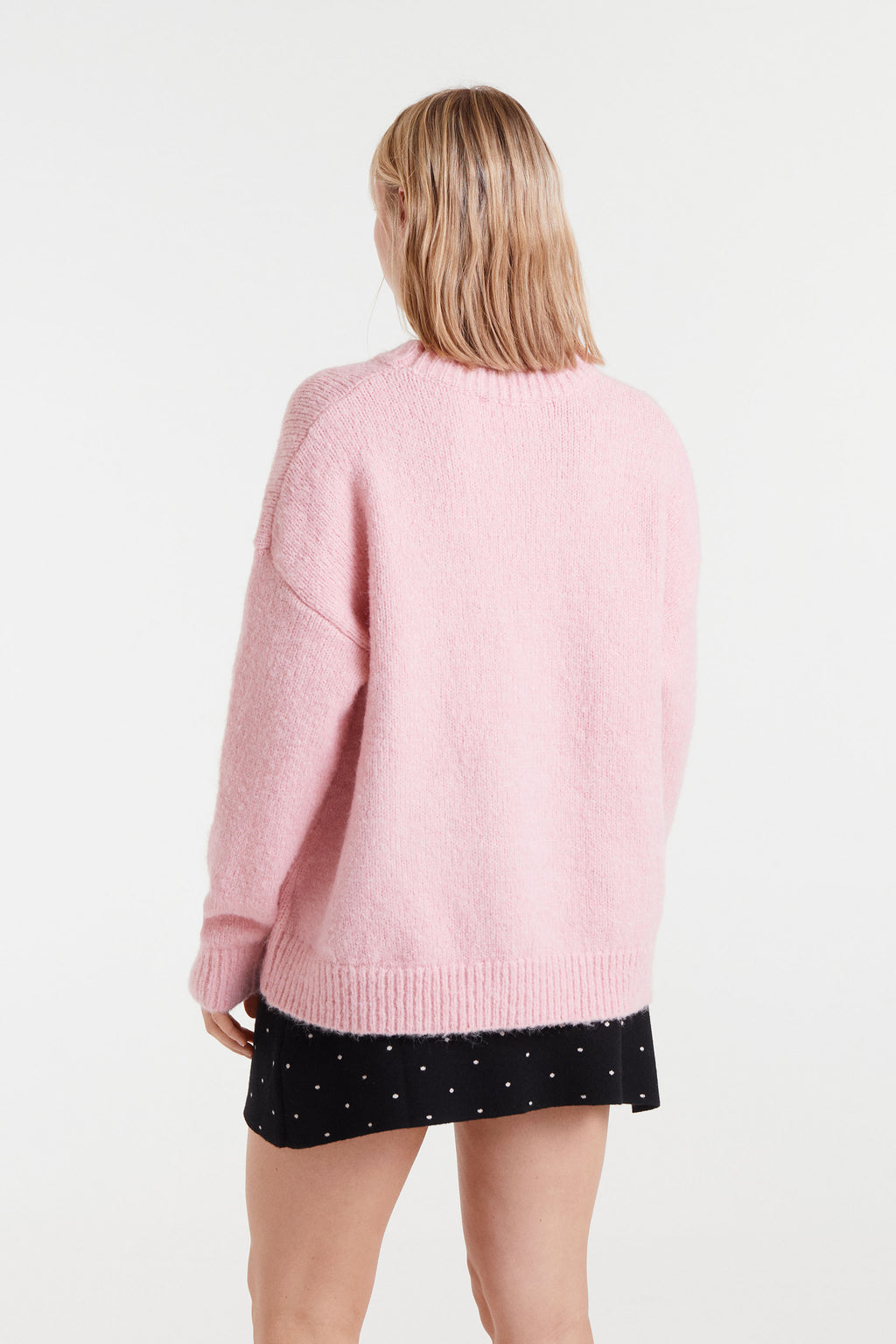 Pink Sweater with Black Strawbery Motif.