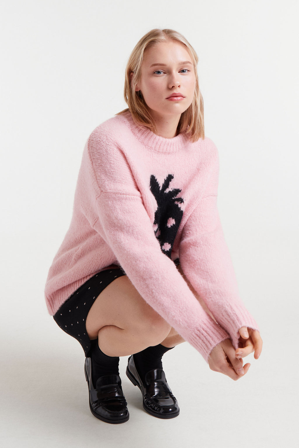Pink Sweater with Black Strawbery Motif.